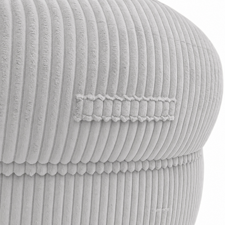 Gros plan sur la poignée du pouf XXL, tissu en velours côtelé.
