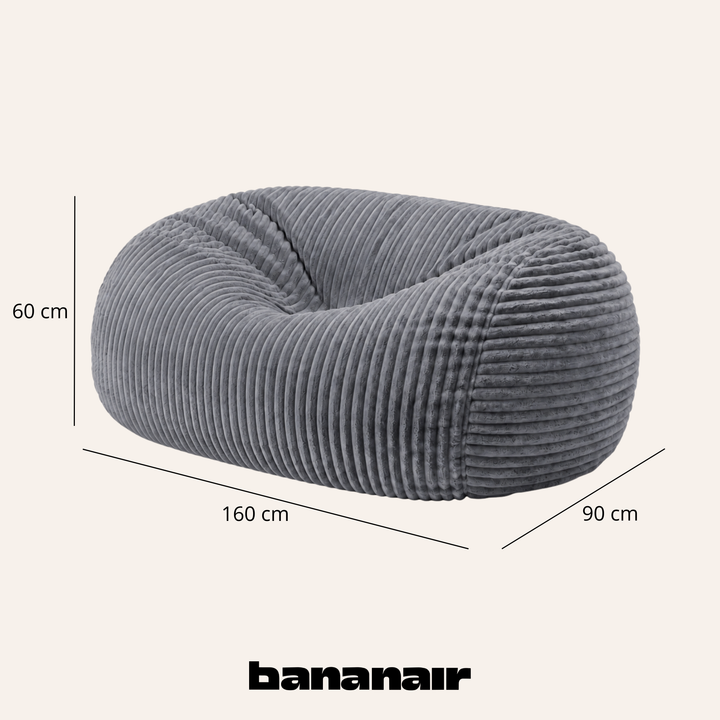Pouf long géant déhoussable en fourrure côtelée gris, dimensions indiquées 160x90x60 cm